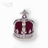 Decorative crown with red velvet and silver accents on a white background, branded 'Crowns & Regalia'.